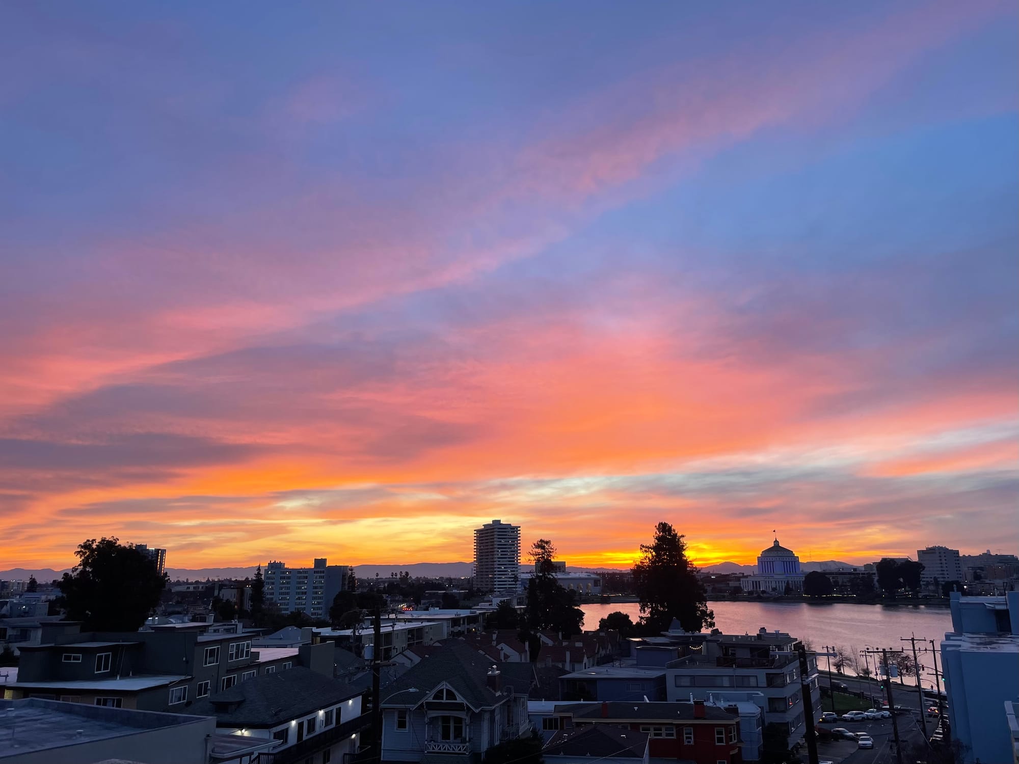 Sunset over a cityscape and water